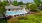 a swimming pool in a courtyard with lounge chairs